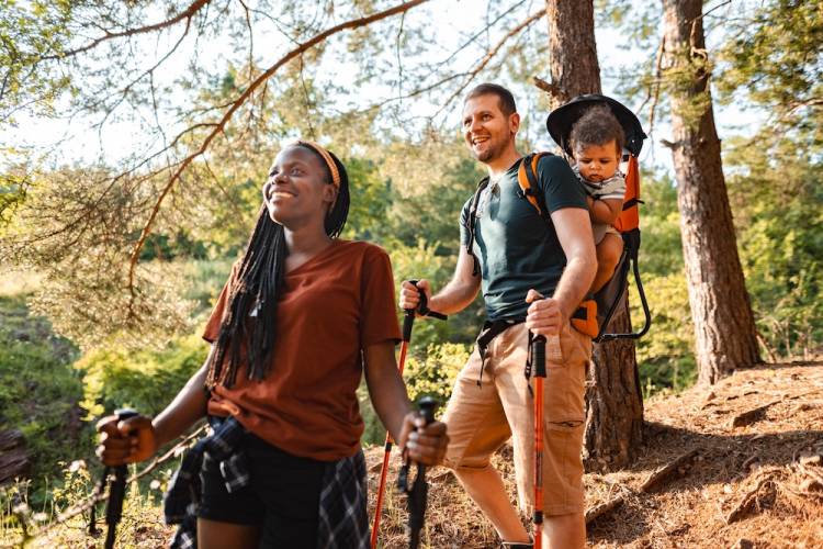 mother, father, and baby on a hike 