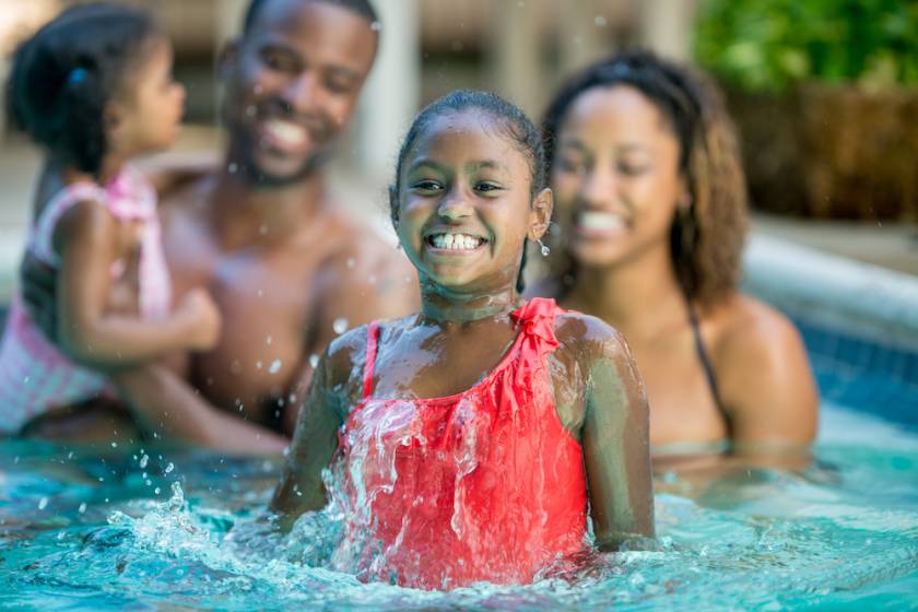 little girl and family at waterpark